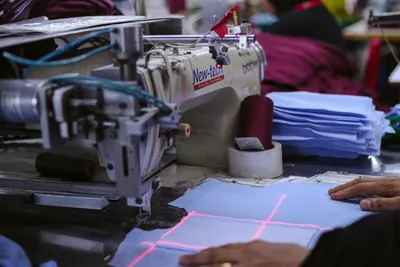 Laser-guided sewing